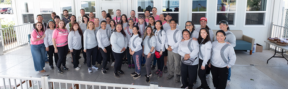 Employees standing in front of clinic